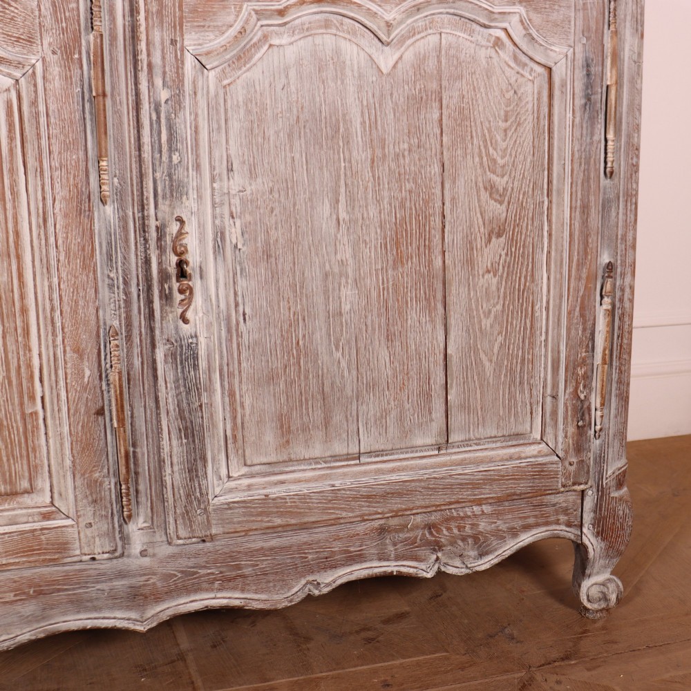 A large four-door French provincial enfilade made from bleached oak, featuring raised panel cupboard doors, four top drawers, and a scalloped apron. View VI