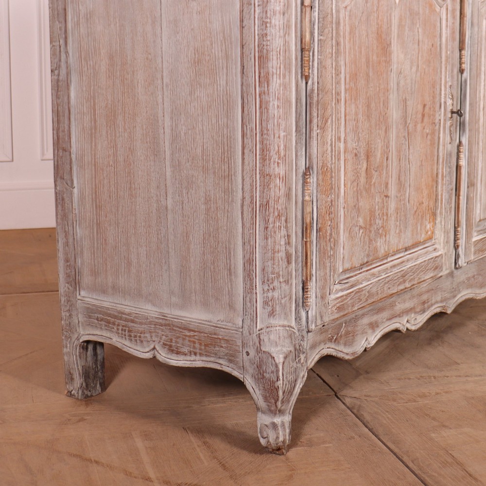 A large four-door French provincial enfilade made from bleached oak, featuring raised panel cupboard doors, four top drawers, and a scalloped apron. View XI