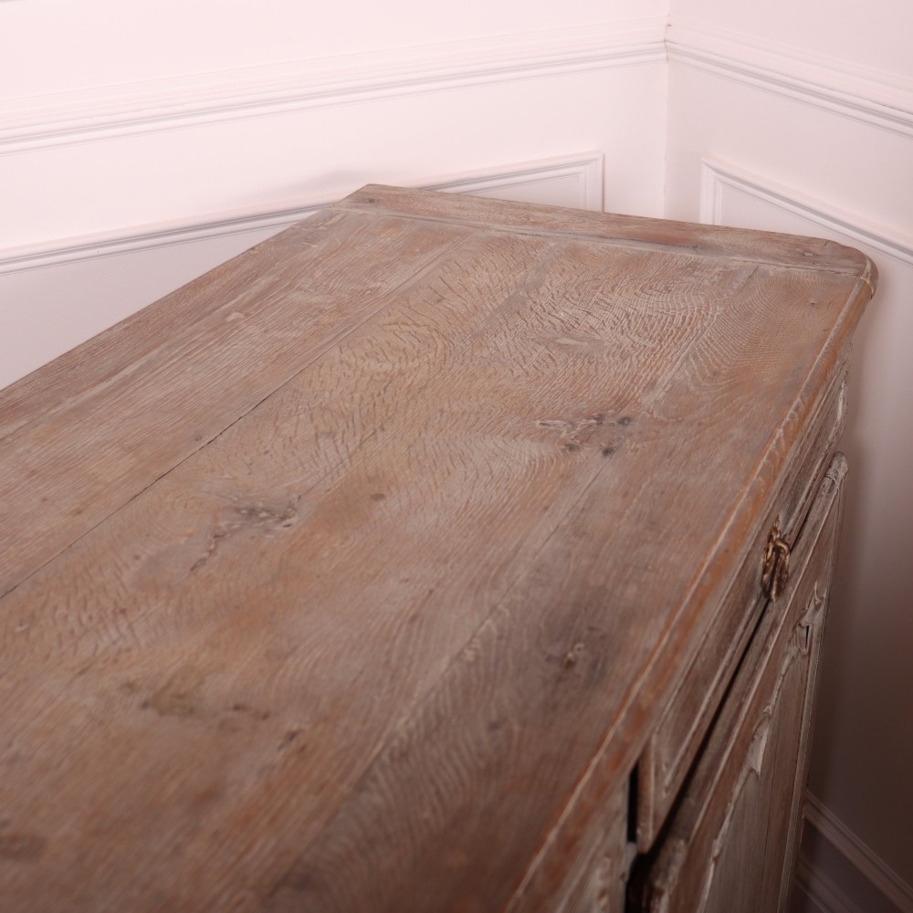 A large four-door French provincial enfilade made from bleached oak, featuring raised panel cupboard doors, four top drawers, and a scalloped apron. View XIV