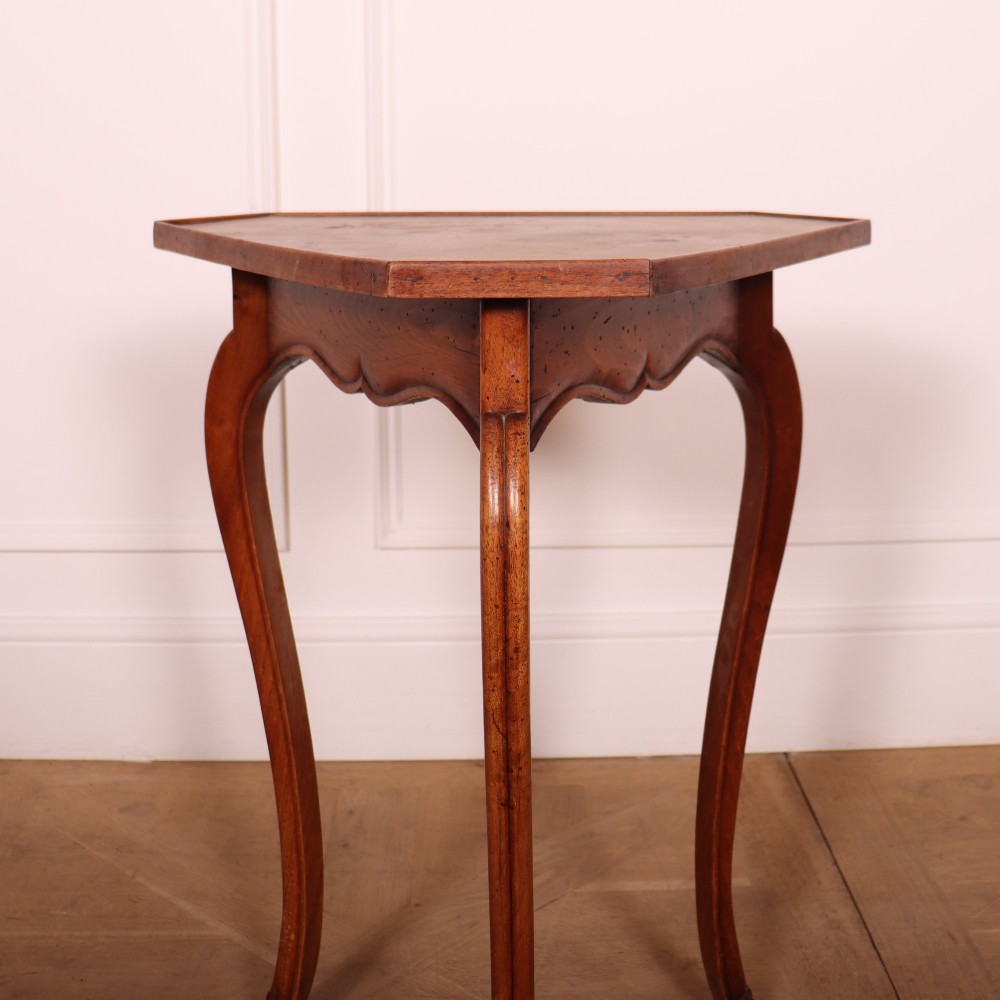 A French cherrywood side table featuring three slender cabriole legs, a shaped top, and a contoured apron with a warm brown finish. View II