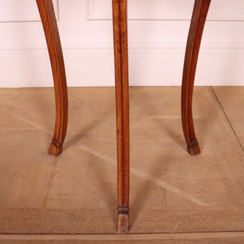 A French cherrywood side table featuring three slender cabriole legs, a shaped top, and a contoured apron with a warm brown finish. View III