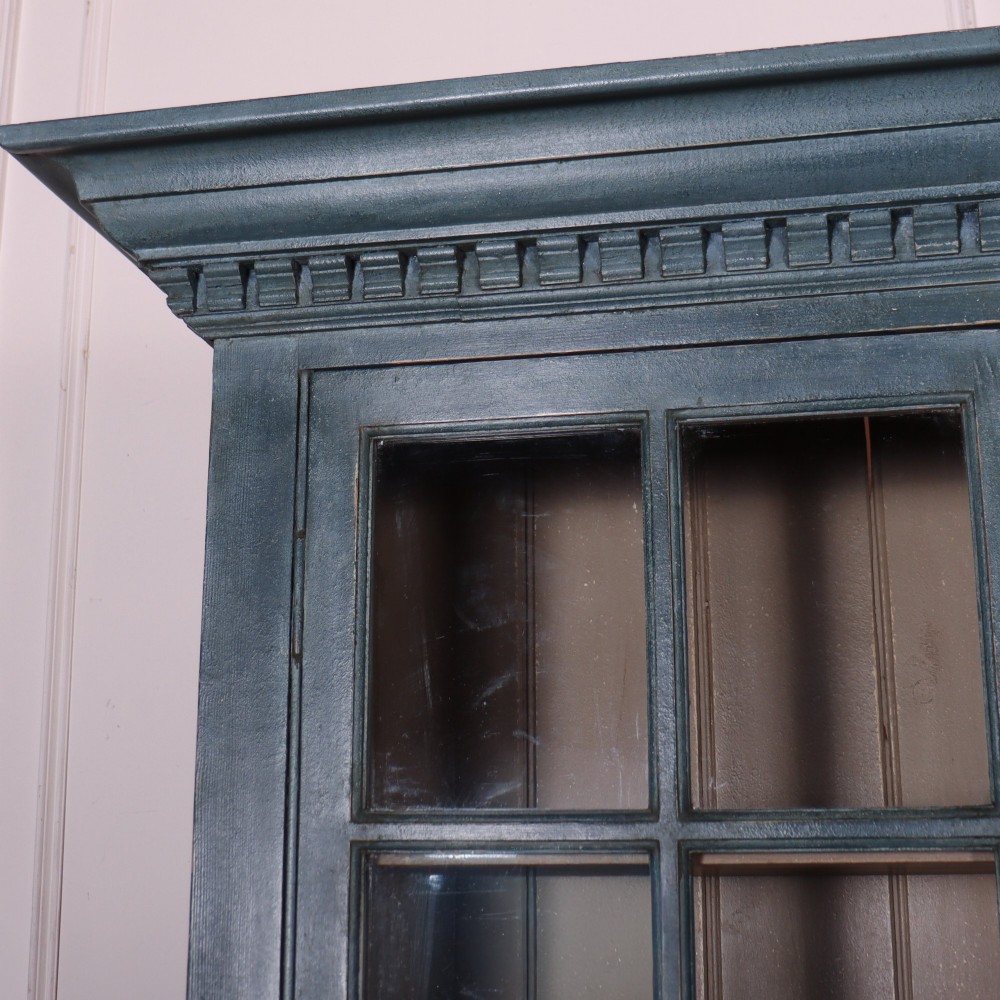 A large slate blue painted wood kitchen dresser featuring a four-door glazed upper cabinet over a four-door panelled cupboard base. View II