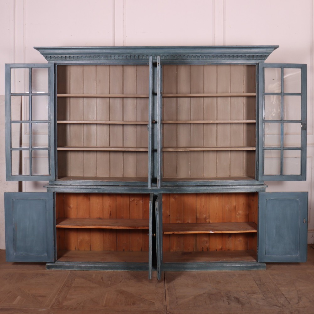 A large slate blue painted wood kitchen dresser featuring a four-door glazed upper cabinet over a four-door panelled cupboard base. View IX
