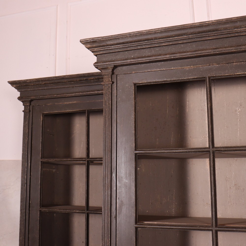 A pair of dark grey painted wooden dressers featuring glazed upper display cabinets with square mullions above panelled two-door lower cupboards. View II