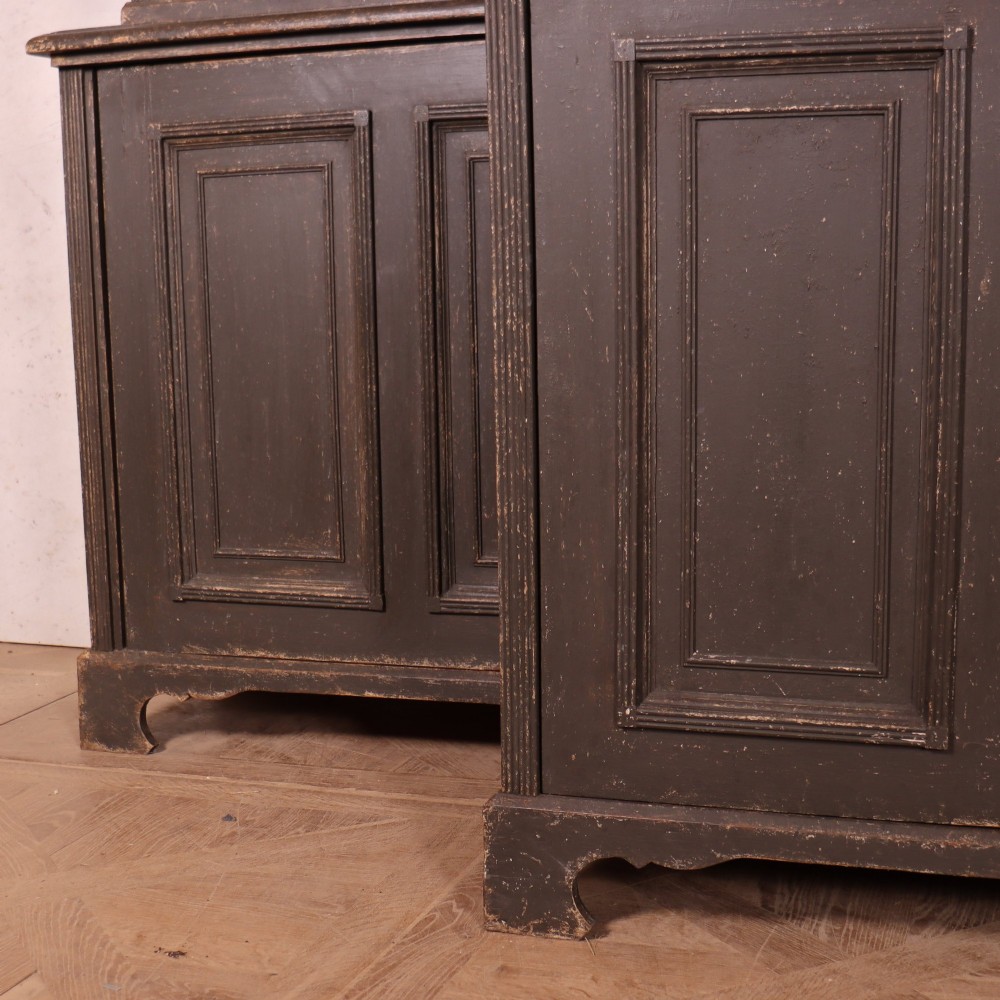 A pair of dark grey painted wooden dressers featuring glazed upper display cabinets with square mullions above panelled two-door lower cupboards. View IV