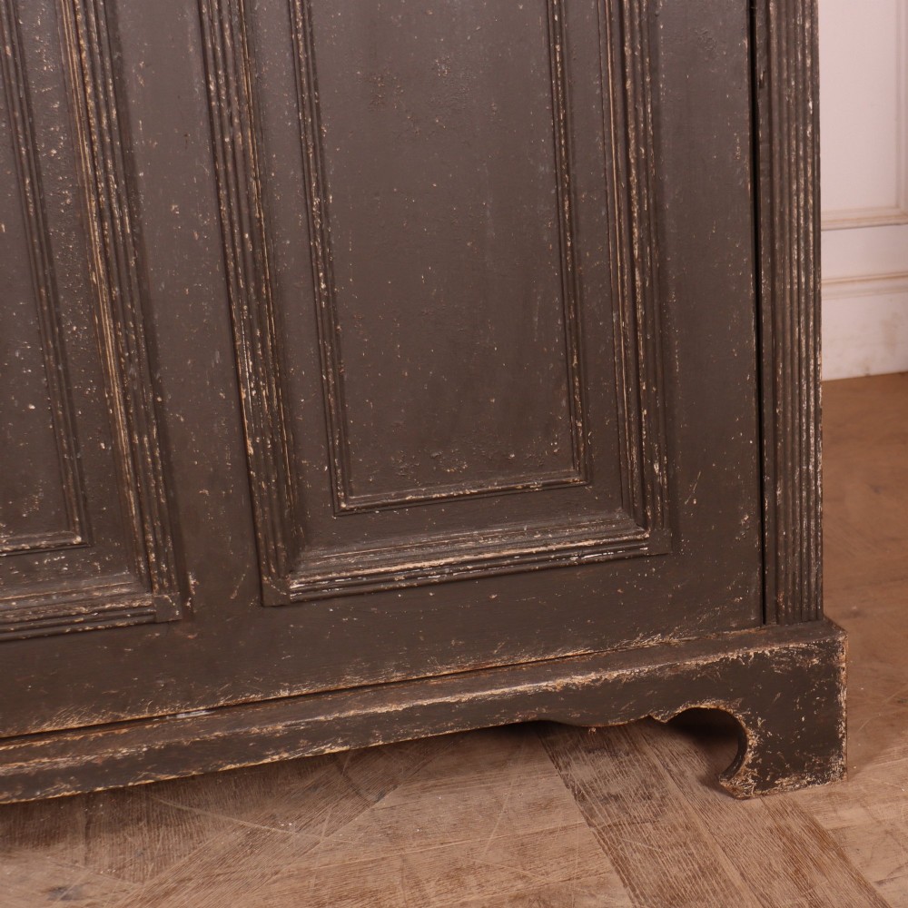 A pair of dark grey painted wooden dressers featuring glazed upper display cabinets with square mullions above panelled two-door lower cupboards. View VII