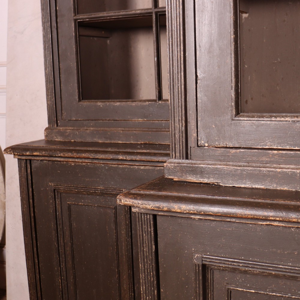 A pair of dark grey painted wooden dressers featuring glazed upper display cabinets with square mullions above panelled two-door lower cupboards. View VIII