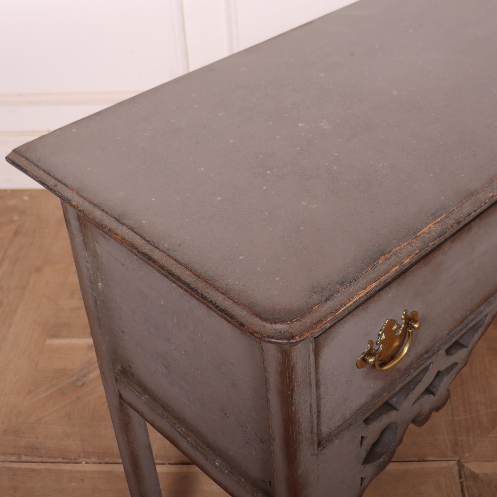 A grey-painted antique dresser base featuring three drawers with brass handles, a decorative pierced fretwork apron, and cabriole legs. View IX
