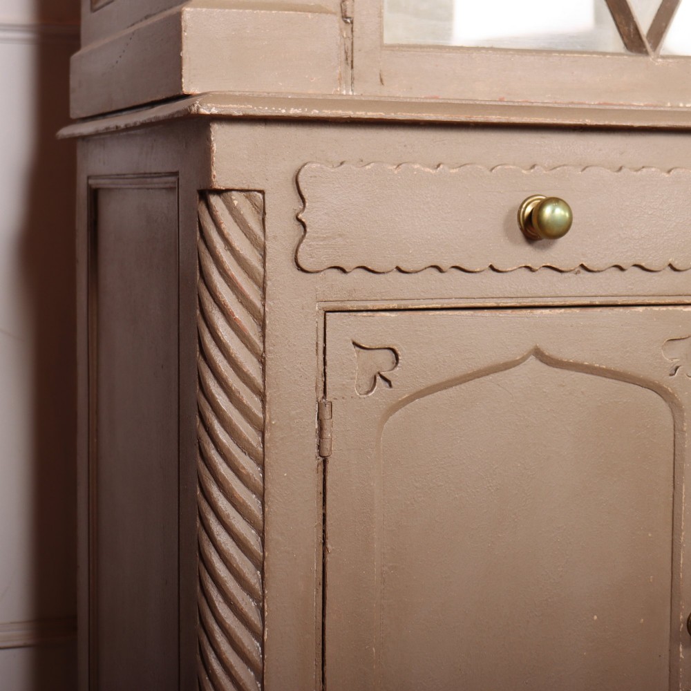 A two-part painted kitchen dresser featuring a glazed upper cabinet with geometric diamond glazing bars over a base with drawers and panelled doors. View XIV