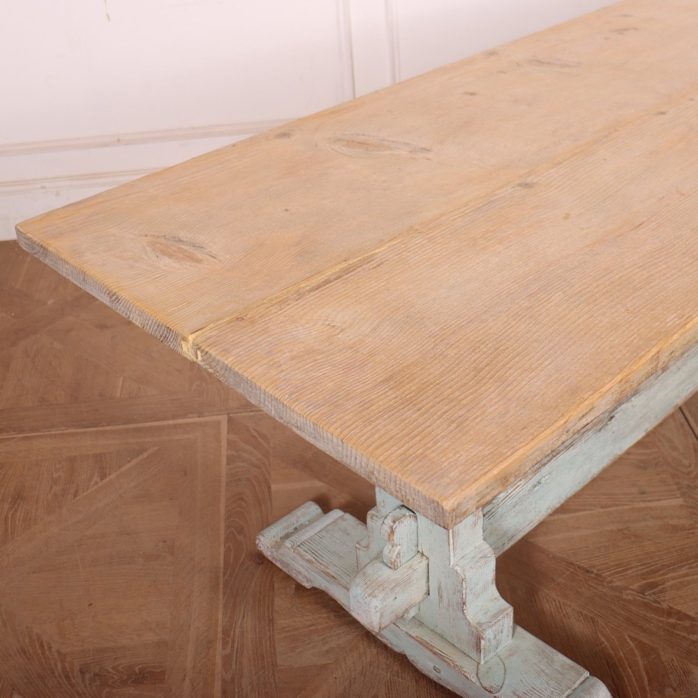 A large Swedish painted trestle dining table with a natural wood scrubbed top and a light blue painted base featuring a pegged stretcher. View V