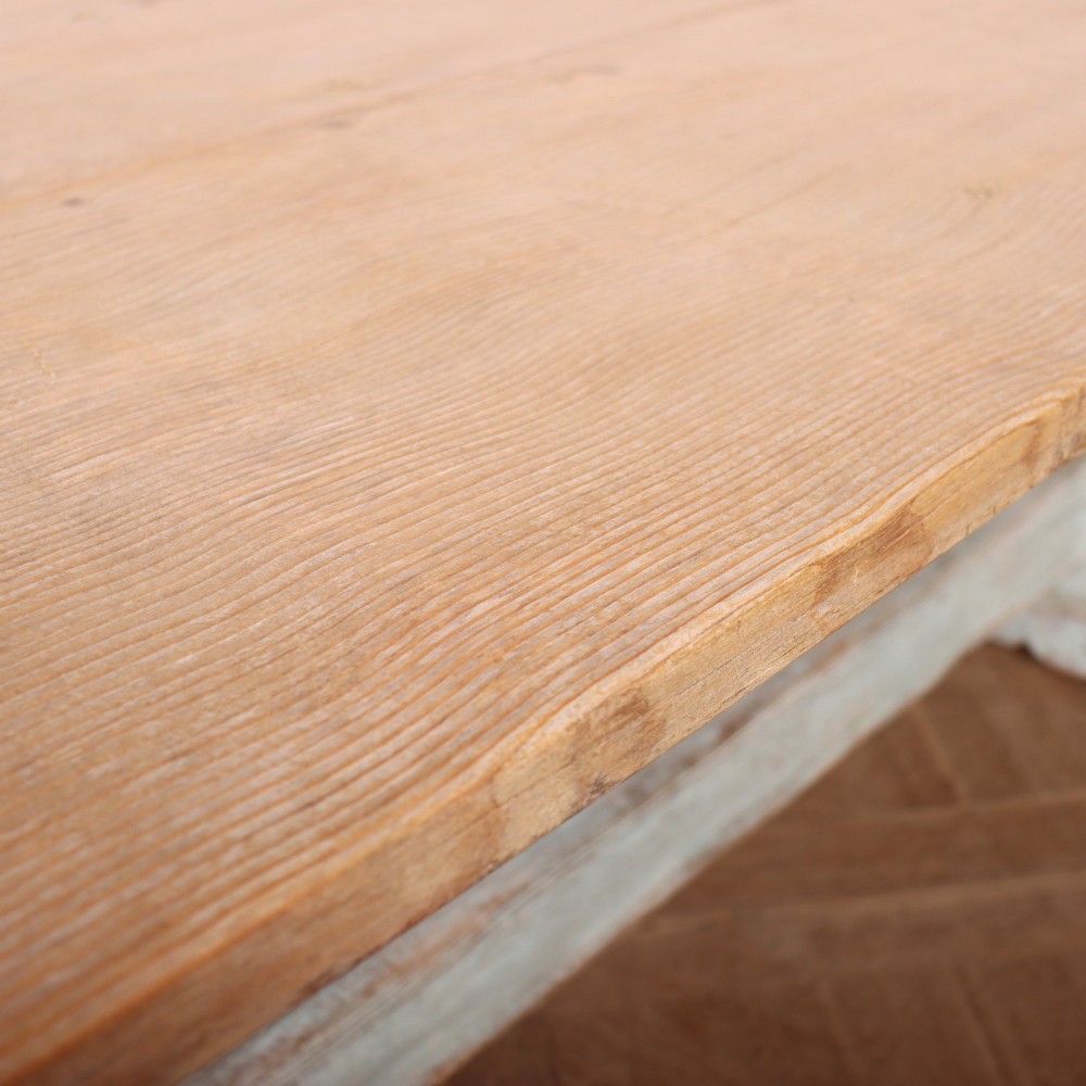 A large Swedish painted trestle dining table with a natural wood scrubbed top and a light blue painted base featuring a pegged stretcher. View VII