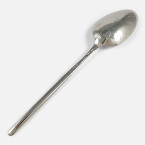 fig 1. An 18th-century sterling silver marrow spoon featuring an oval bowl connected to a long, narrow channelled handle.
