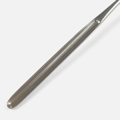 fig 3. An 18th-century sterling silver marrow spoon featuring an oval bowl connected to a long, narrow channelled handle.
