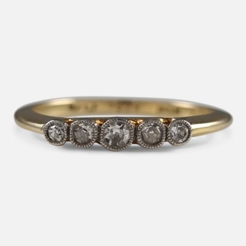fig 1. An 18ct yellow gold band mounted with five round diamonds in platinum millegrain rub-over settings.