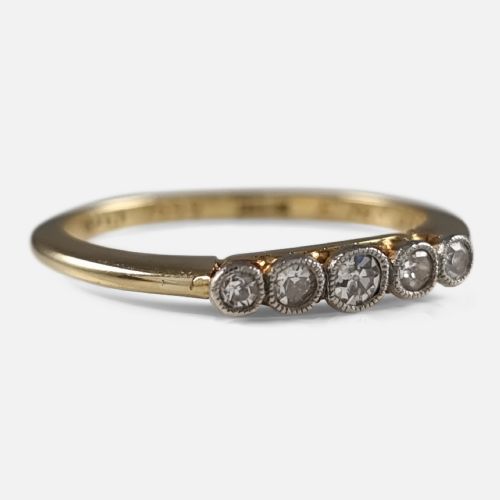 fig 2. An 18ct yellow gold band mounted with five round diamonds in platinum millegrain rub-over settings.