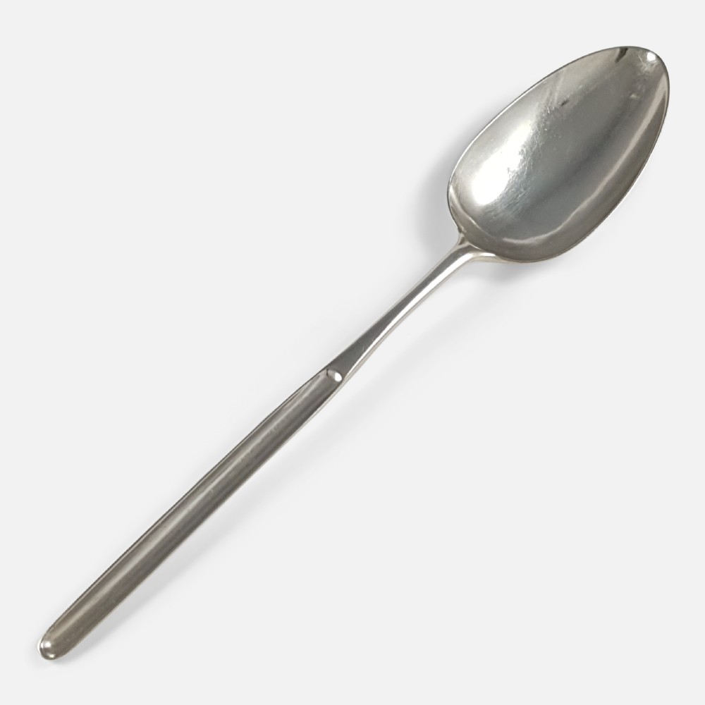 An 18th-century sterling silver marrow spoon featuring an oval bowl connected to a long, narrow channelled handle.