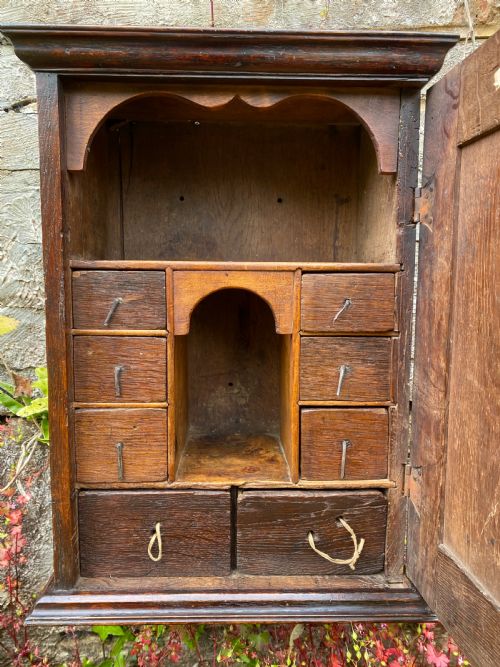AN EARLY OAK SPICE WALL CUPBOARD - ADDITIONAL PHOTO 8