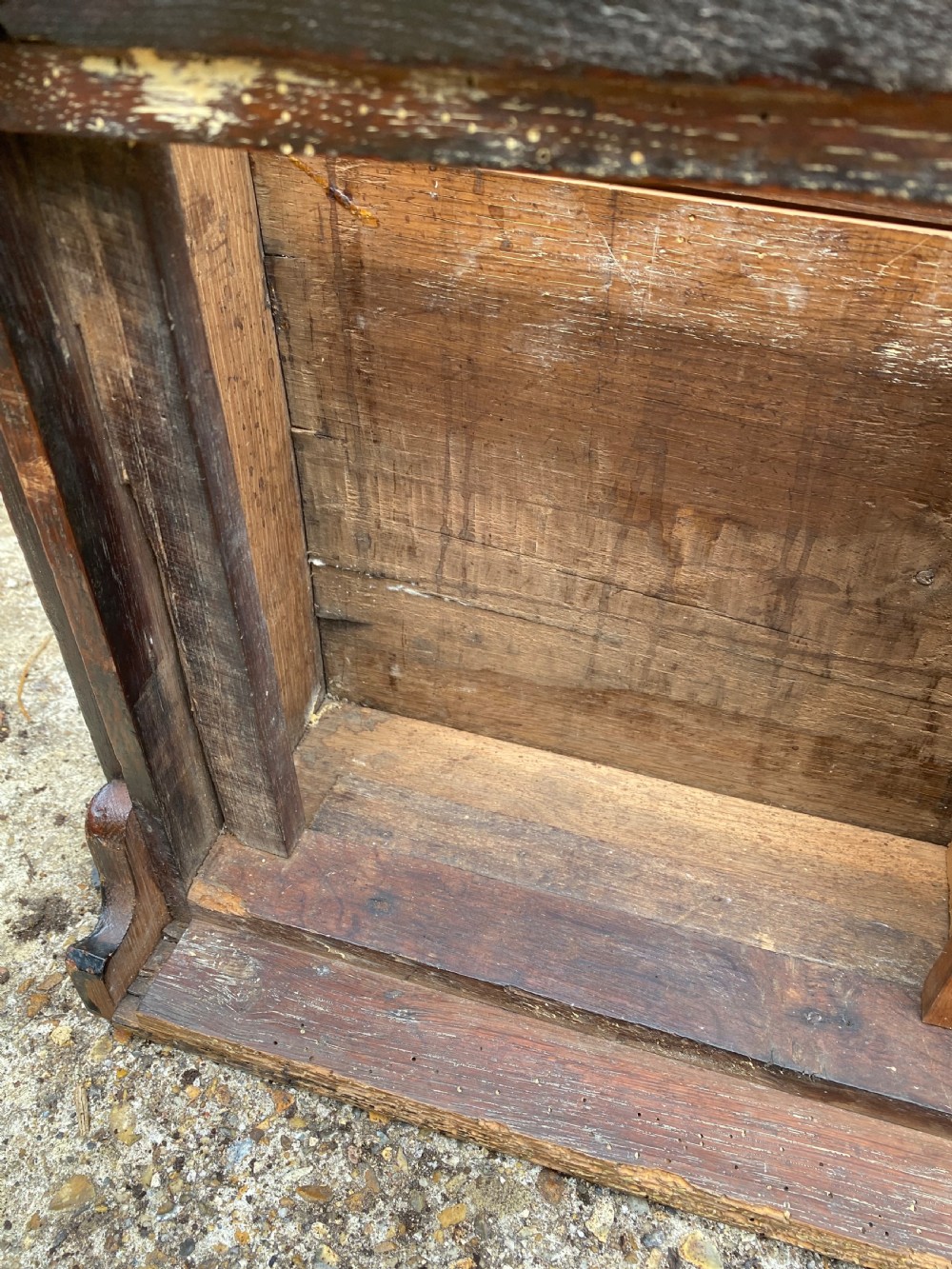 A carved dark oak Georgian coffer bach featuring a hinged lid, relief-carved floral panels, two lower drawers, and bracket feet. View XXIII