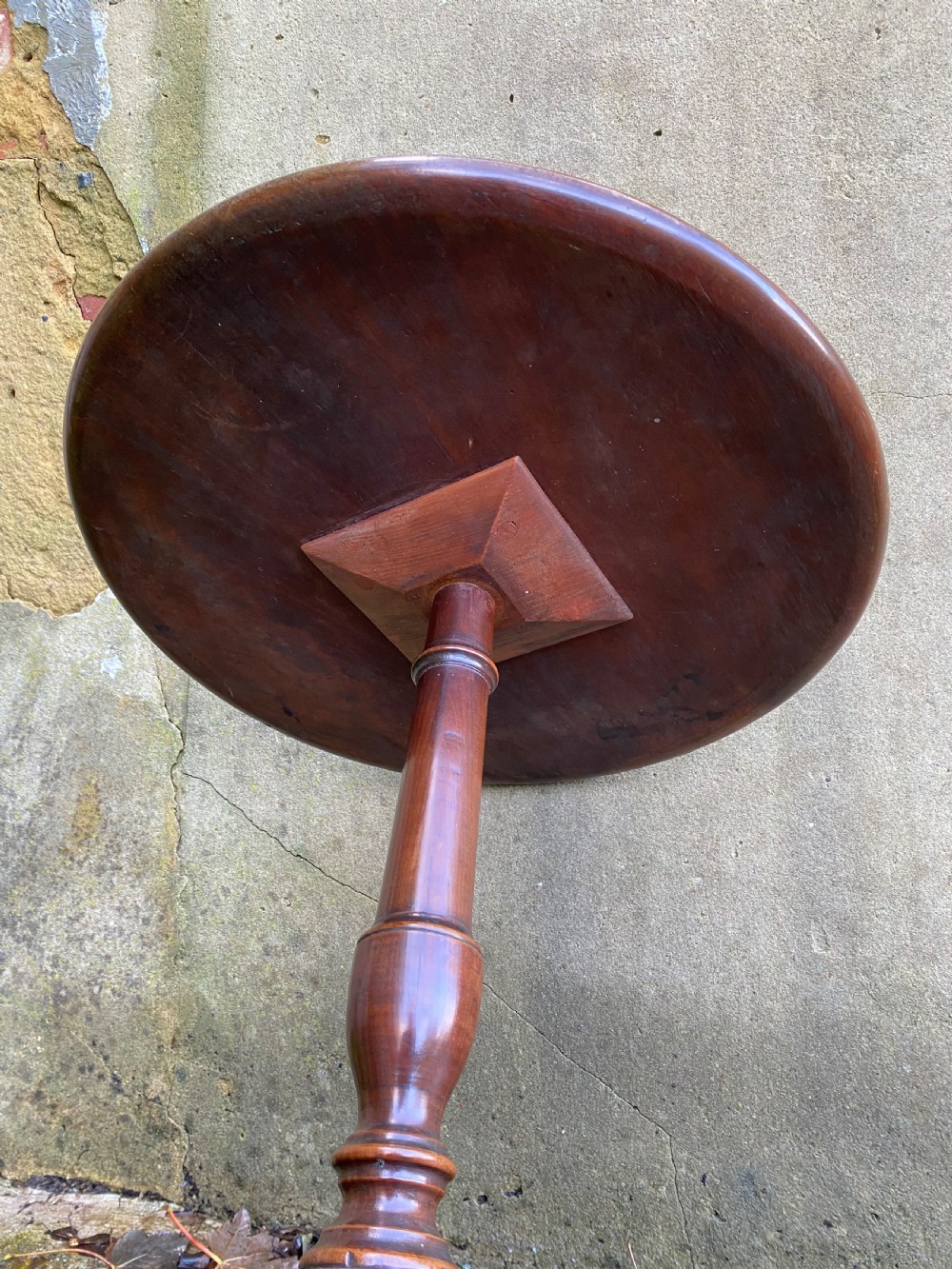 A Georgian mahogany circular side table featuring a dished top, a turned central column, and three tripod cabriole legs. View XI