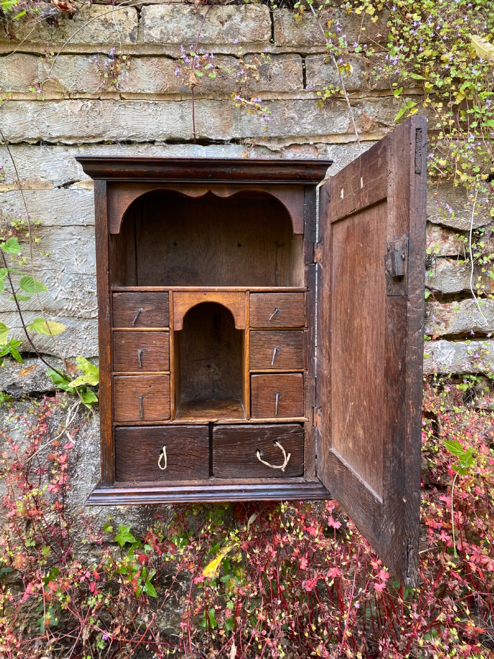 An Early Oak Spice wall Cupboard 