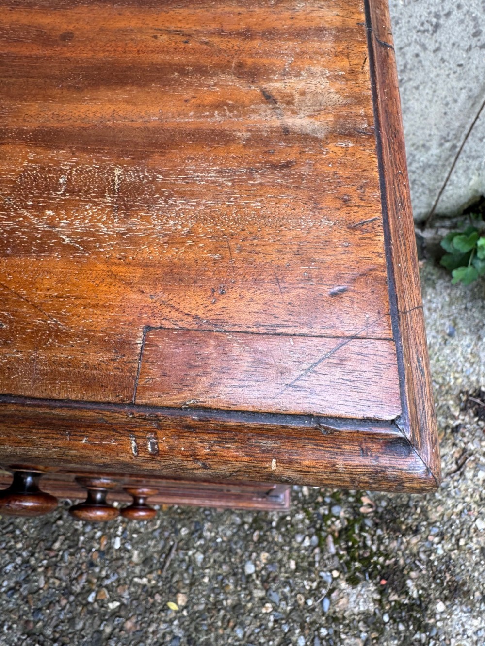 A Georgian mahogany chest featuring four graduated drawers with turned wooden knobs, keyhole escutcheons, and classic bracket feet. View IX