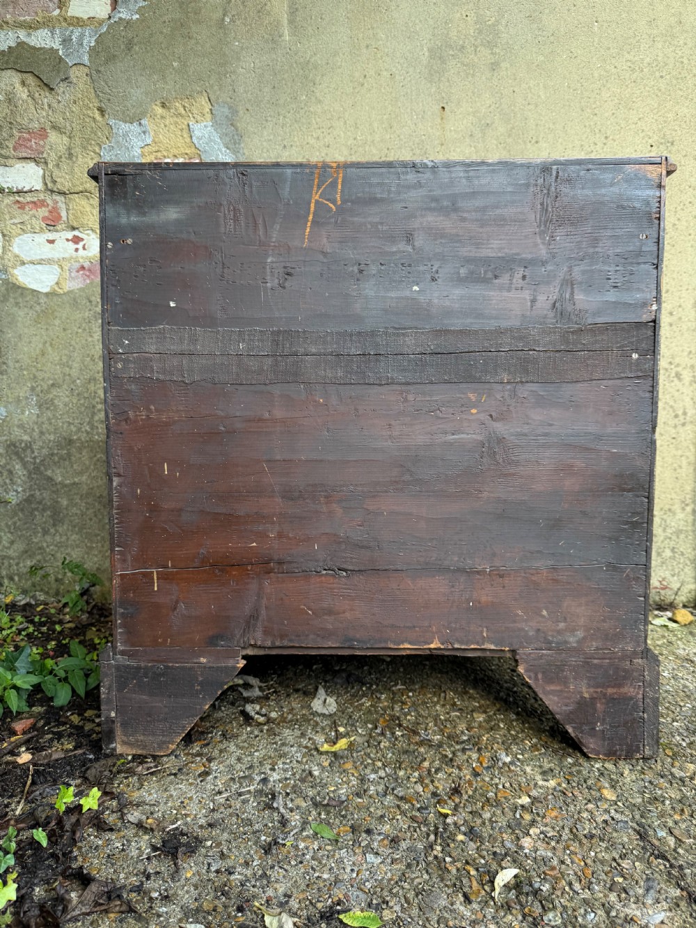 A Georgian mahogany chest featuring four graduated drawers with turned wooden knobs, keyhole escutcheons, and classic bracket feet. View XXI