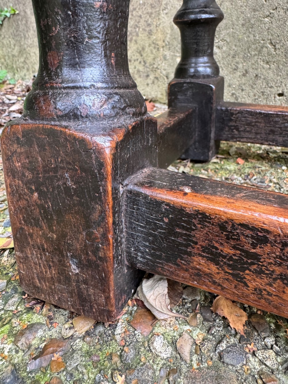 A dark oak joint stool featuring turned baluster legs, lower perimeter stretchers, and a flat rectangular top. View XV