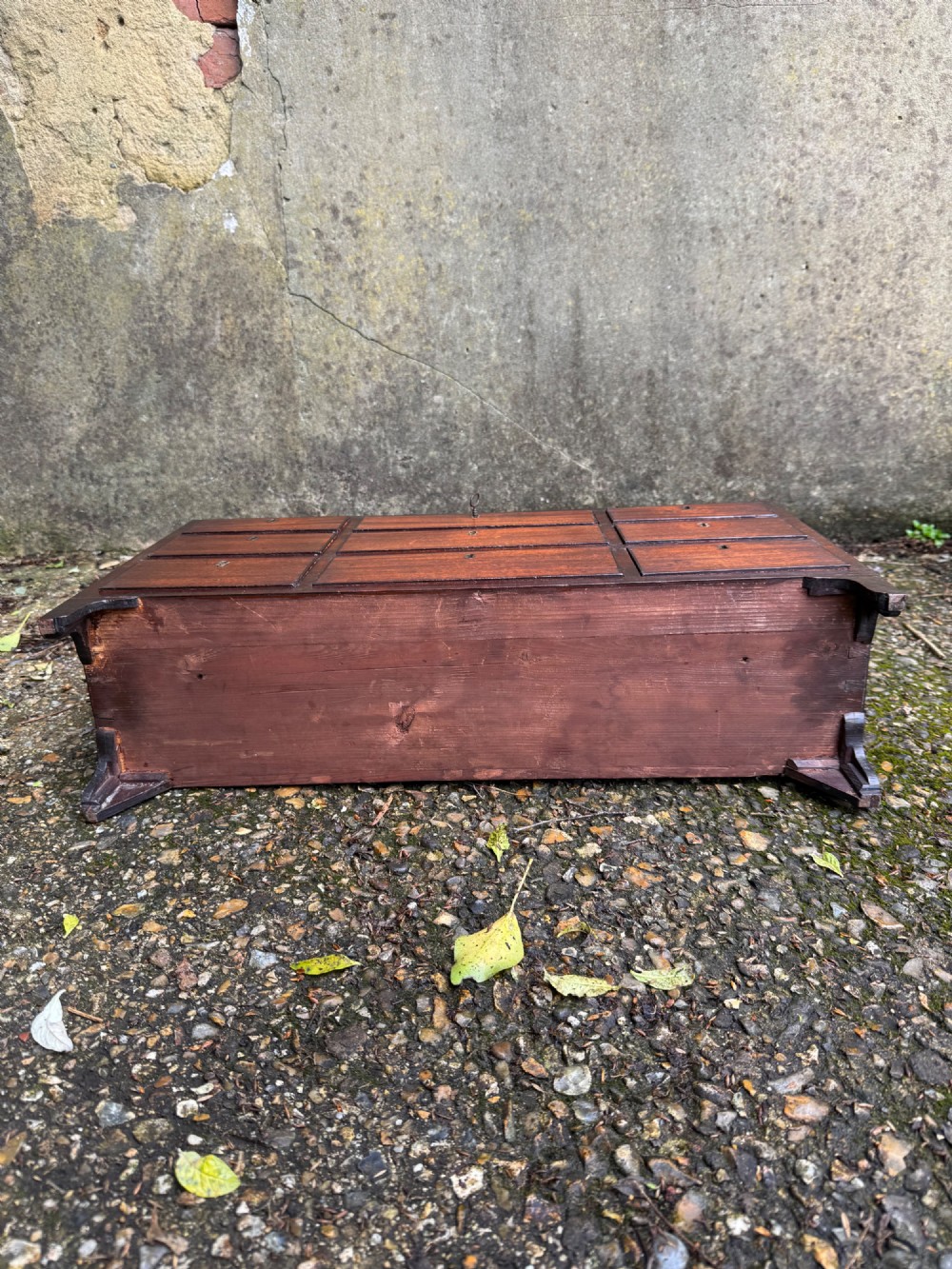 A dark Georgian mahogany flight of nine drawers with brass keyhole escutcheons resting on short bracket feet. View XIV