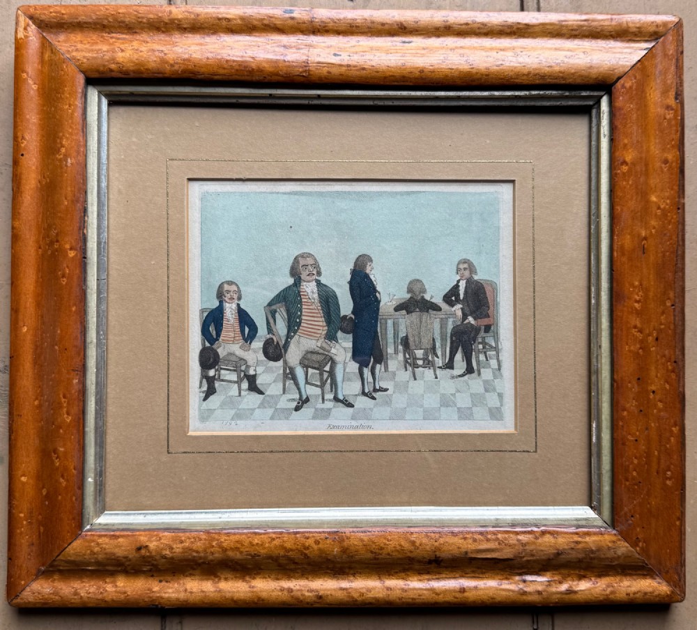 A framed Georgian hand-coloured etching titled Examination depicting figures in 18th-century dress set within a thick, light brown wood frame. View II