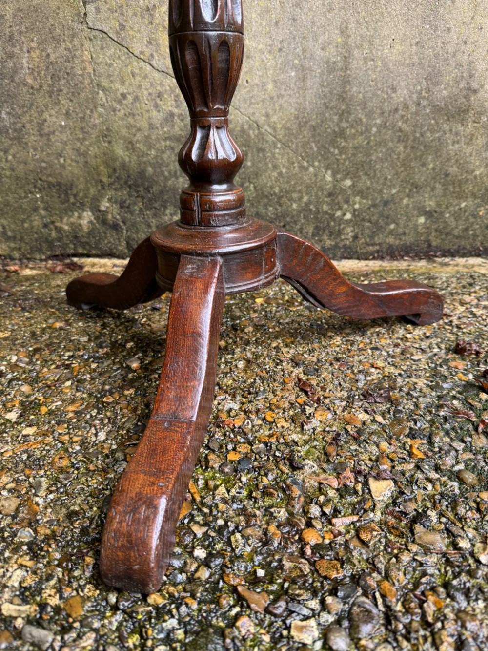 A tall dark oak side table featuring a circular top, a single barley twist column, and three splayed tripod legs. View VI