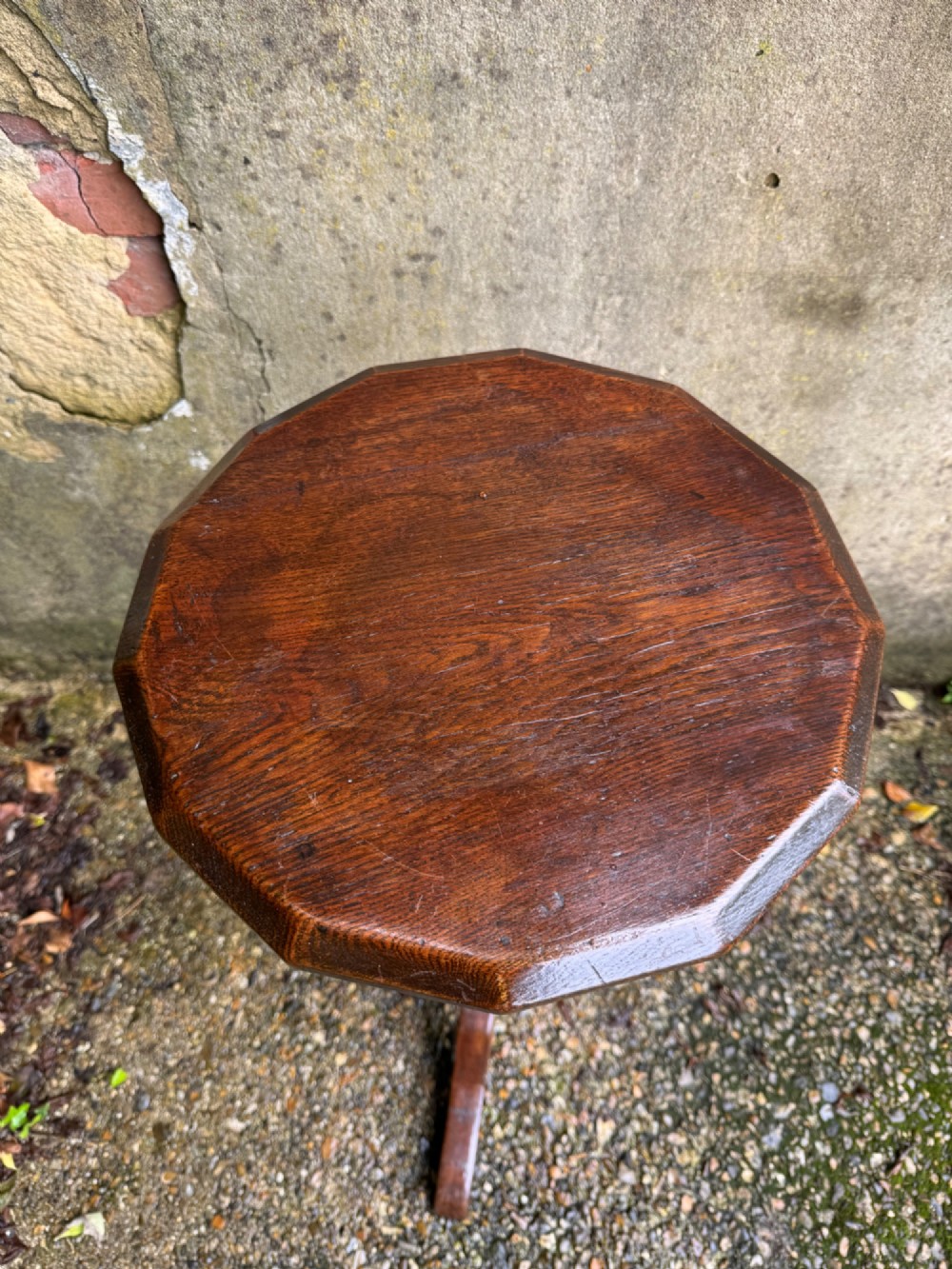 A tall dark oak side table featuring a circular top, a single barley twist column, and three splayed tripod legs. View VIII