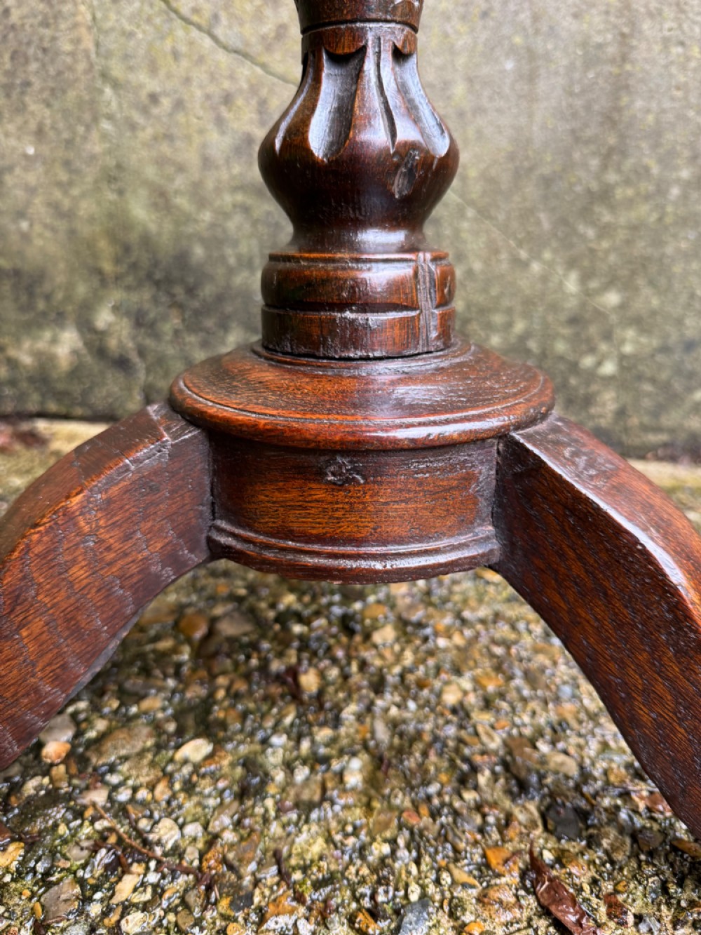 A tall dark oak side table featuring a circular top, a single barley twist column, and three splayed tripod legs. View XIV