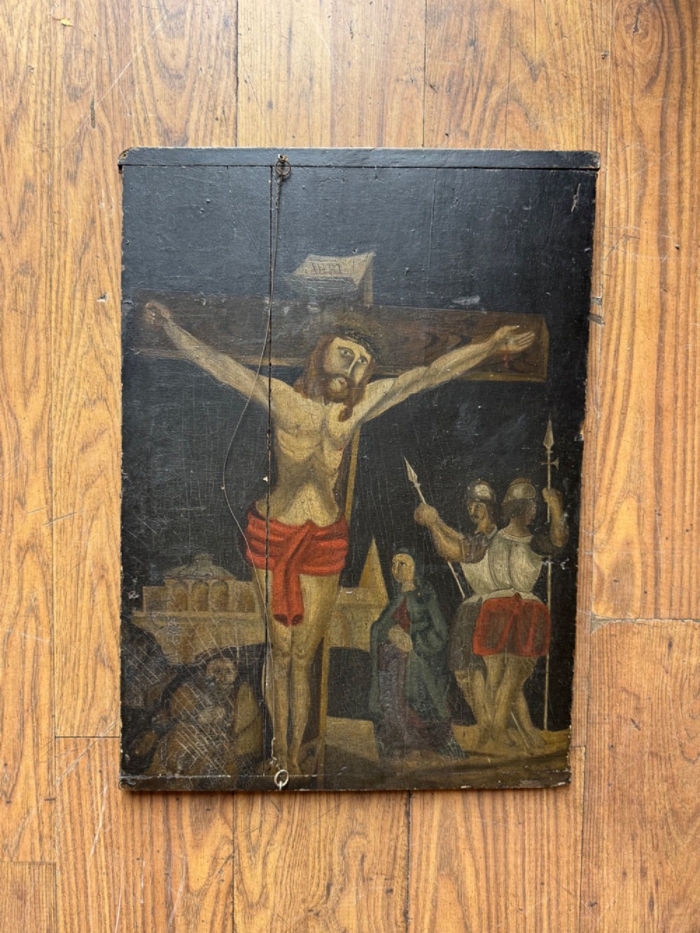 A rectangular antique wooden panel featuring four distinct naive painted oil scenes depicting churches, country houses, sailing ships, and pastoral landscapes. View VIII