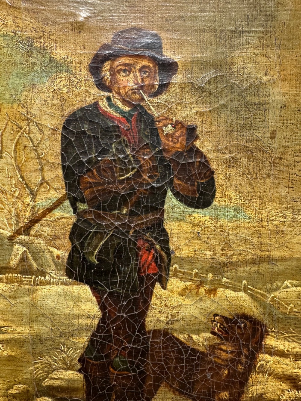 An antique oil painting depicting a standing man with a pipe and his dog in a countryside landscape, housed in a deep silvered moulded frame. View IV