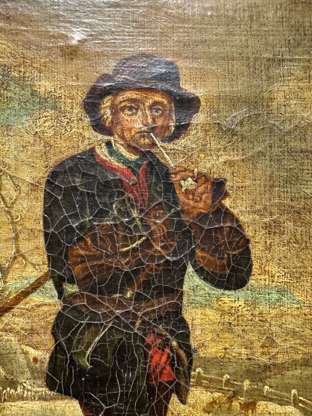 An antique oil painting depicting a standing man with a pipe and his dog in a countryside landscape, housed in a deep silvered moulded frame. View V