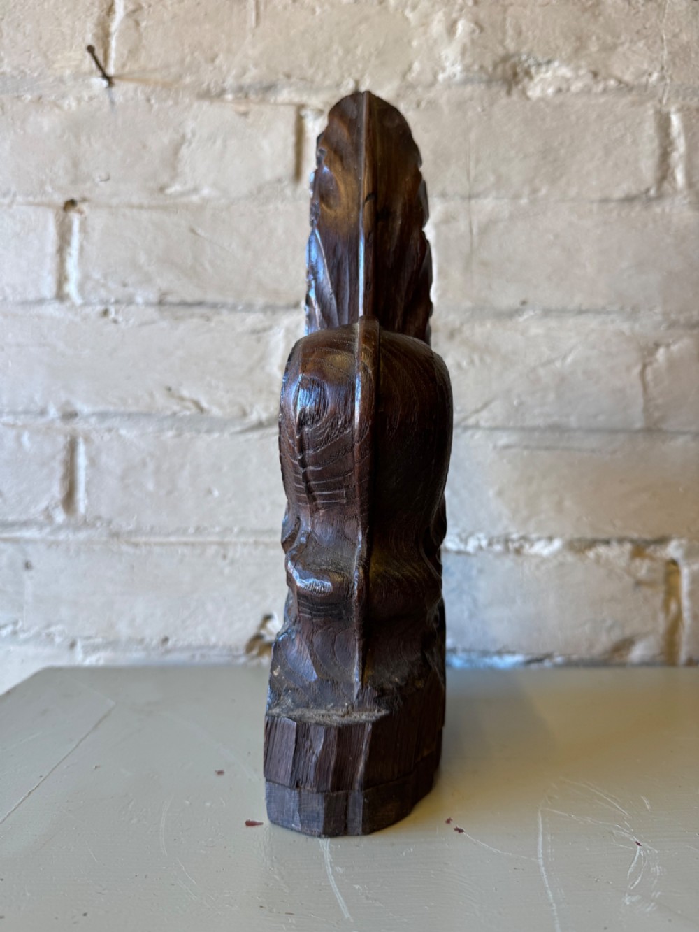A hand-carved dark oak poppy head finial featuring intricate Gothic leaf motifs standing vertically. View IV