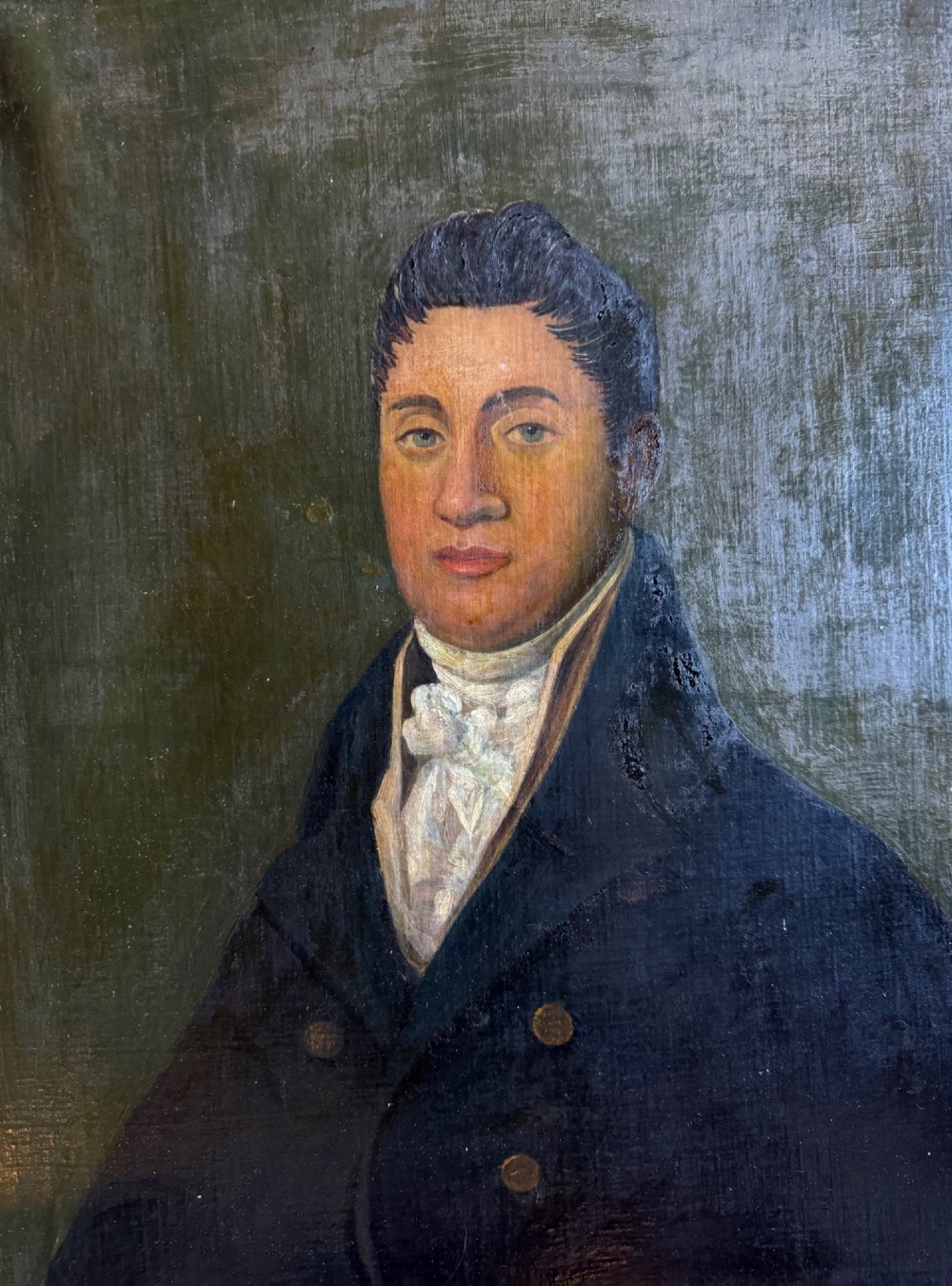 An antique oil painting depicting a gentleman in a dark double-breasted coat and white cravat, set within an ornate gold giltwood frame. View III