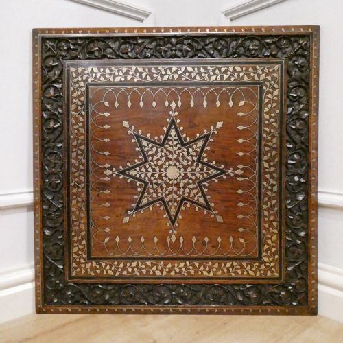 fig 1. A late 19th-century square Anglo-Indian side table featuring brass inlay with a central star motif and pierced carved wood aprons.