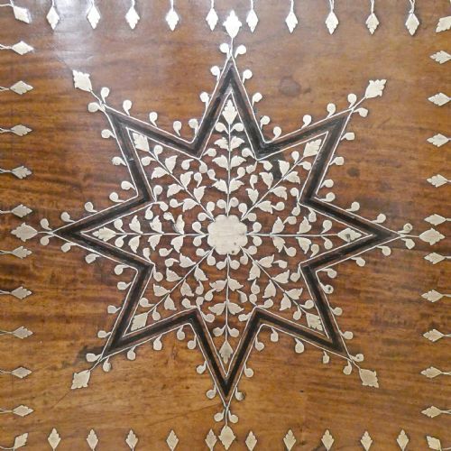 fig 2. A late 19th-century square Anglo-Indian side table featuring brass inlay with a central star motif and pierced carved wood aprons.