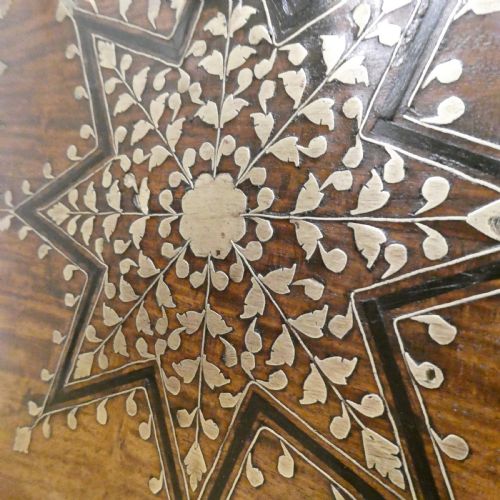 fig 3. A late 19th-century square Anglo-Indian side table featuring brass inlay with a central star motif and pierced carved wood aprons.