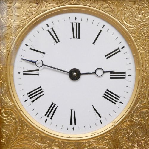 fig 2. An Edwardian rectangular ebonised wooden mantel clock and barometer unit with twin white circular dials set into a scroll-engraved brass plate.