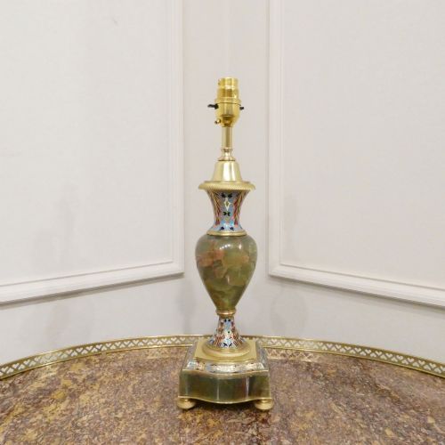 fig 1. A pair of French table lamps featuring urn-shaped green onyx columns detailed with polychrome champleve enamelling and topped with pleated white shades.