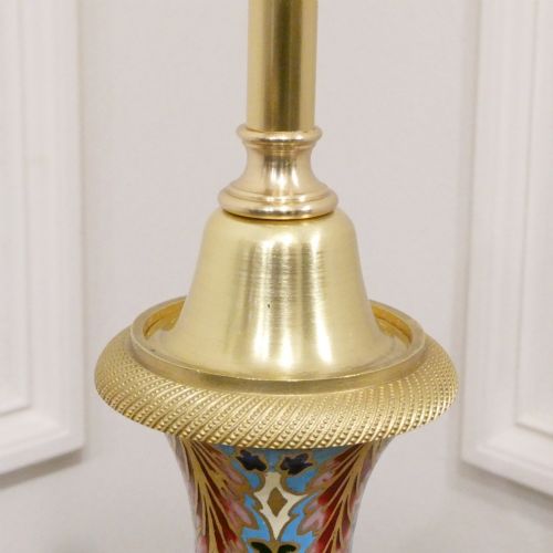 fig 3. A pair of French table lamps featuring urn-shaped green onyx columns detailed with polychrome champleve enamelling and topped with pleated white shades.