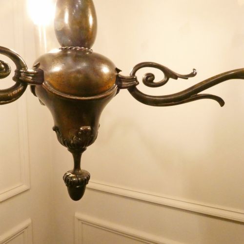 fig 3. An early 20th-century Dutch bronze two-light chandelier featuring a baluster-turned central stem and curved scrolling arms.