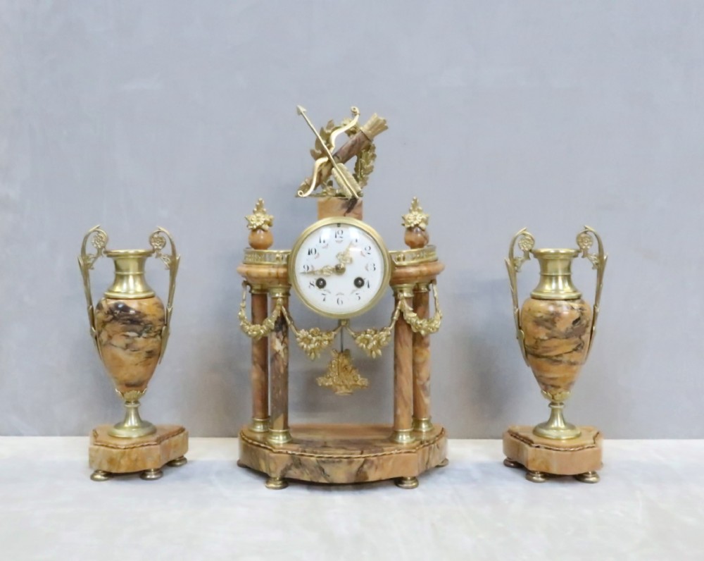 French Louis XVI Style Sienna Marble and Bronze Gilt Clock Set