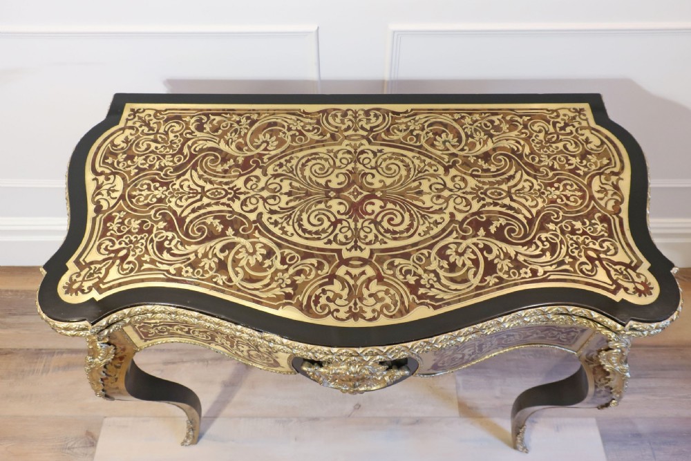 A French Louis XV style side table featuring detailed Boulle marquetry in brass and tortoiseshell with gilt-bronze mounts and cabriole legs. View II