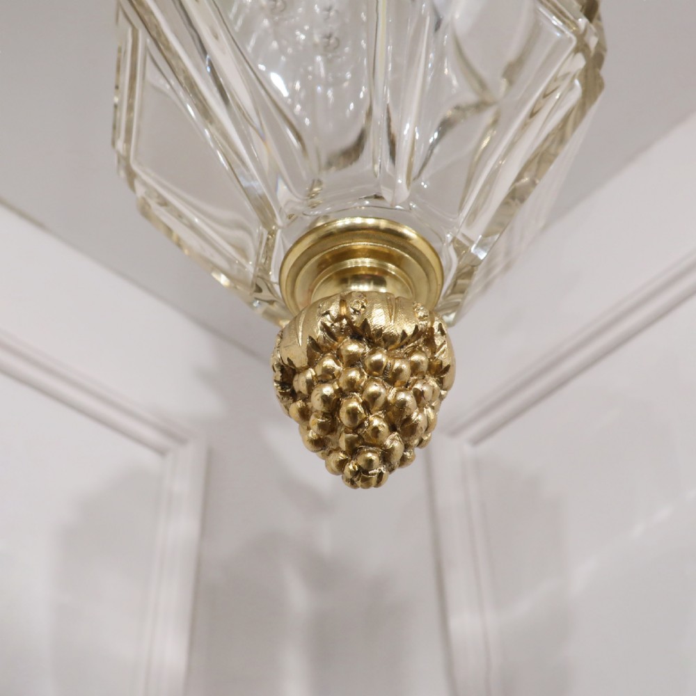 A French Louis XVI style ceiling lantern featuring gilt bronze mounts, a carved acanthus leaf canopy, faceted cut glass body, and a knopped drop finial. View VIII
