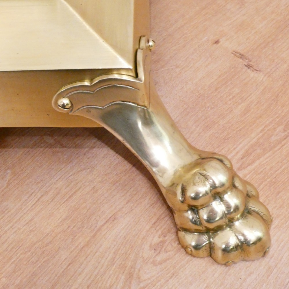 A Victorian brass standard floor lamp featuring a Corinthian capital, stepped base with claw feet, and a fringed cream shade with red tassels. View VI