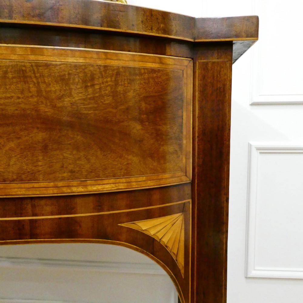 A Georgian mahogany bowfront side table featuring a single drawer with two oval brass handles and square tapered legs. View IV