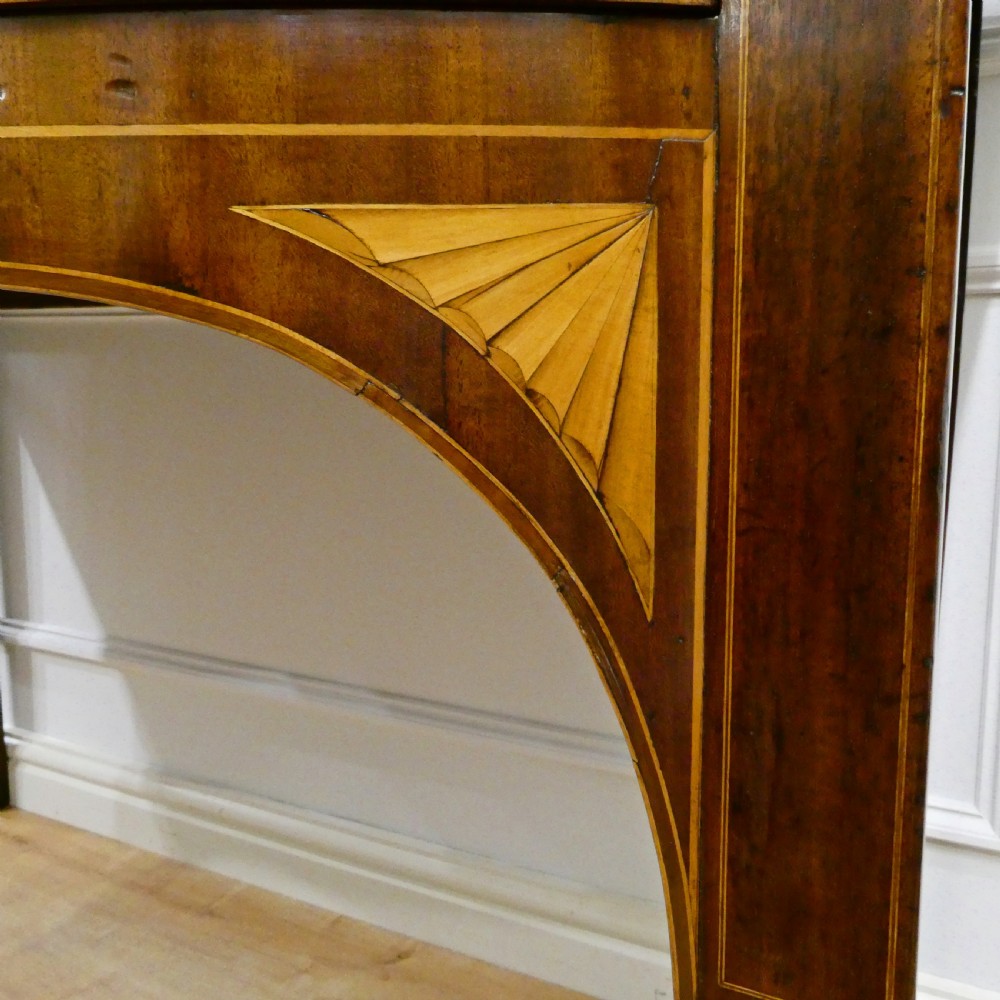 A Georgian mahogany bowfront side table featuring a single drawer with two oval brass handles and square tapered legs. View V